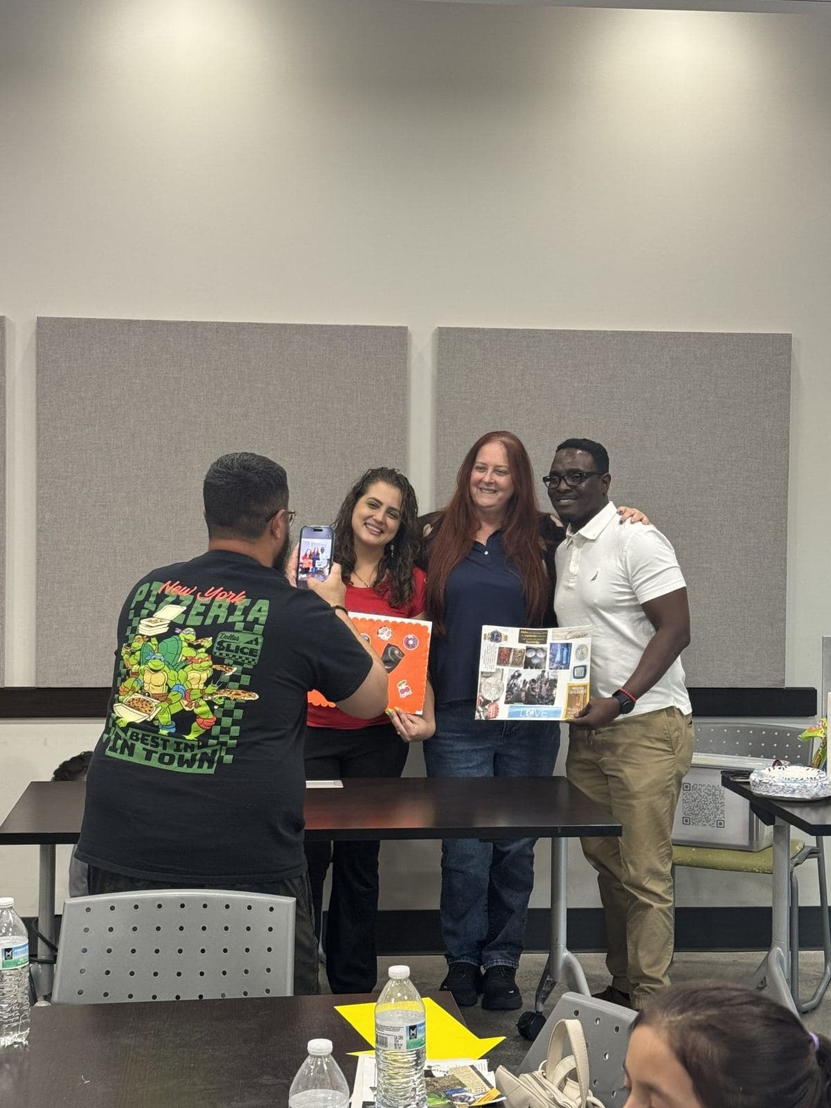 Participants having their photograph taken while proudly holding completed vision boards