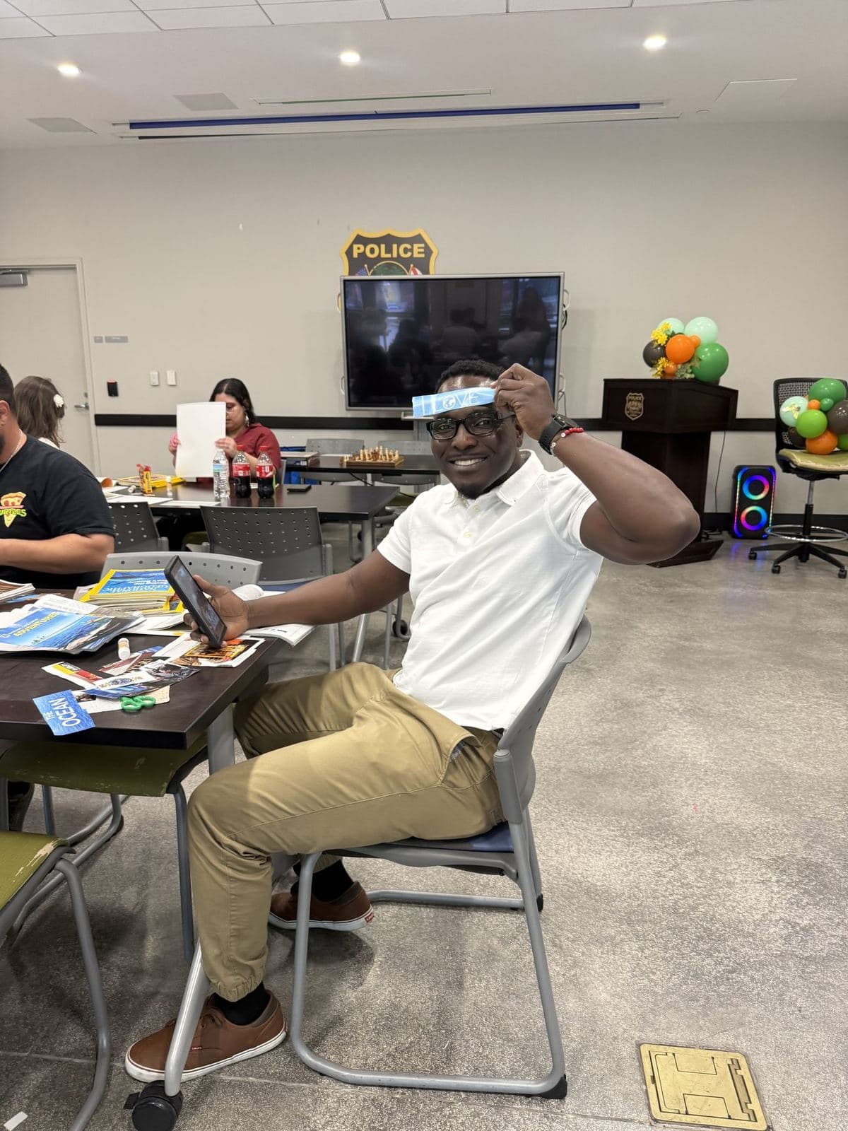 An ACES team member smiling during a community activity session